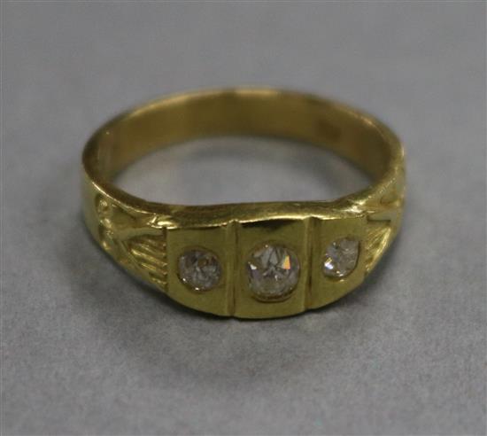 An 18ct gold and three stone diamond ring, size M/N.